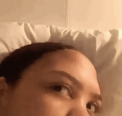 Woman Lying In Bed With White Pillow GIF