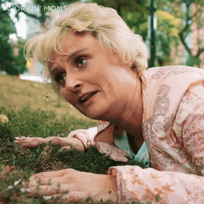 Woman Lying In Grass Workin Moms GIF