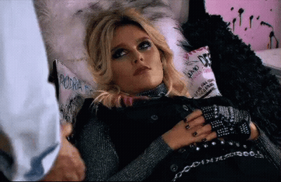 Woman Lying On Bed Hands On Chest GIF