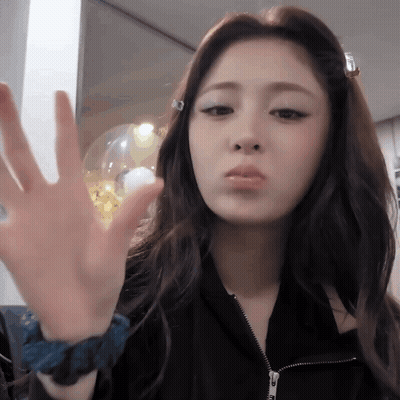 Woman Making Face In Black Jacket And Blue Wristband GIF