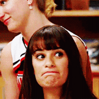 Woman Making Face While Another Looks On GIF