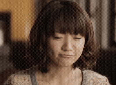 Woman Making Face With Eyes Closed GIF