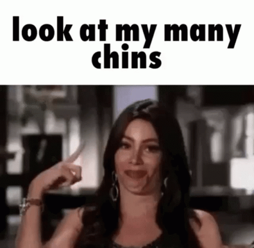 Woman Making Funny Face And Pointing At Chins GIF
