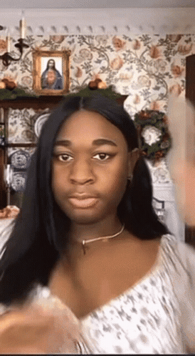 Woman Making Funny Face At Jesus Picture GIF