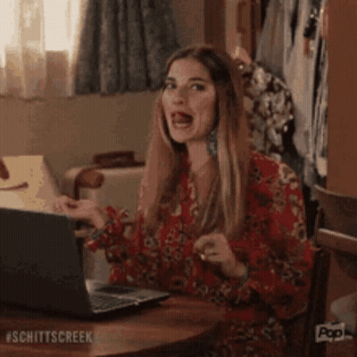 Woman Making Funny Face At Laptop GIF