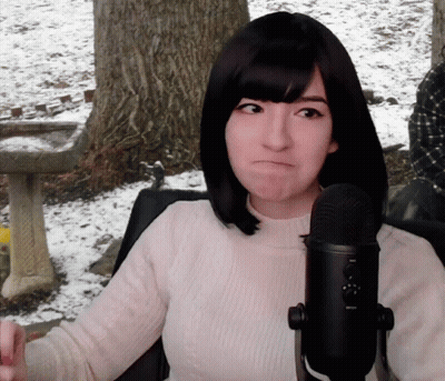 Woman Making Funny Face At Microphone GIF