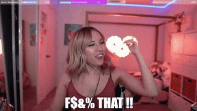 Woman Making Funny Face At Microphone In Bedroom GIF