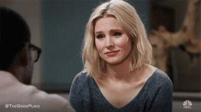 Woman Making Funny Face At Table With Man GIF