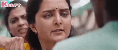 Woman Making Funny Face Beside Man And Two Women GIF