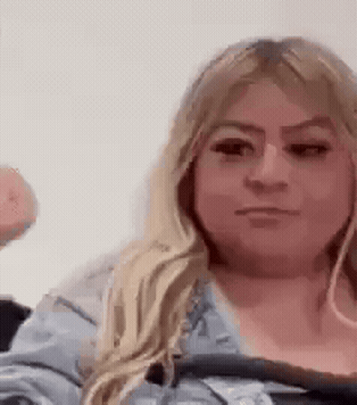 Woman Making Funny Face Holding Donut GIF