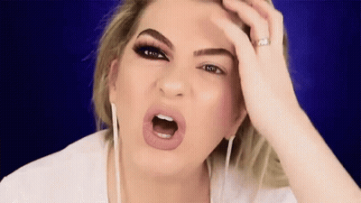 Woman Making Funny Face Holding Head GIF