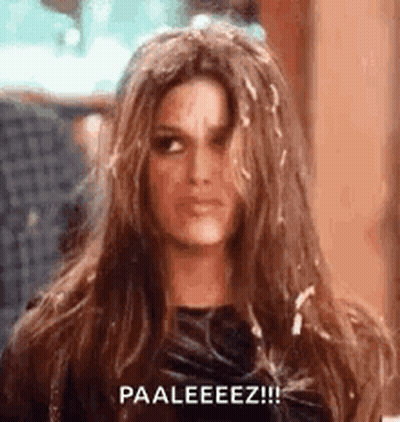 Woman Making Funny Face Holding Ponytail GIF