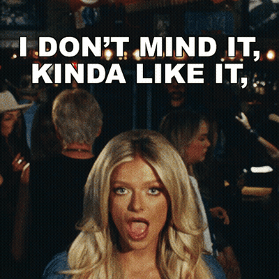 Woman Making Funny Face I Don't Mind It Kinda Like It GIF