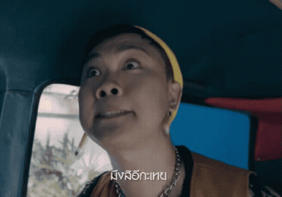 Woman Making Funny Face In Car GIF