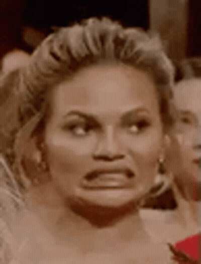 Woman Making Funny Face In Crowd GIF
