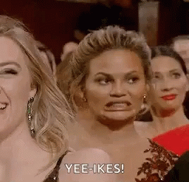 Woman Making Funny Face In Crowd GIF