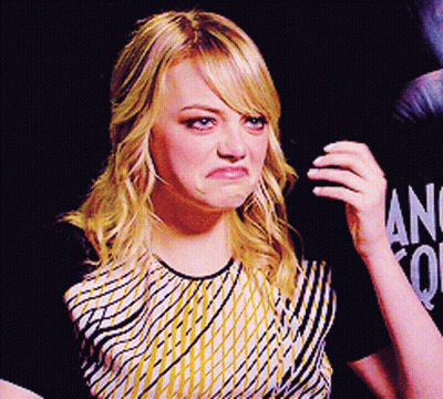 Woman Making Funny Face In Front Of Ang Sign GIF