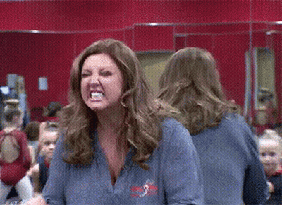 Woman Making Funny Face In Mirror GIF