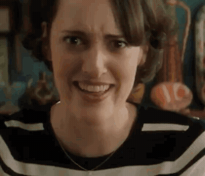 Woman Making Funny Face In Striped Shirt GIF
