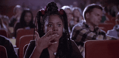 Woman Making Funny Face In Theater GIF