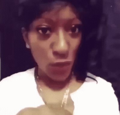 Woman Making Funny Face in White Shirt and Necklace