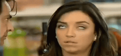 Woman Making Funny Face Looking At Man GIF