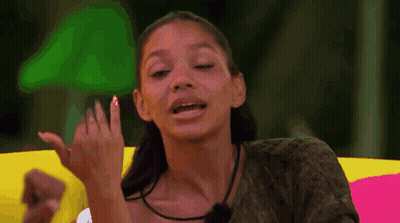 Woman Making Funny Face On Colorful Couch GIF