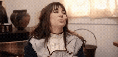 Woman Making Funny Face On Couch GIF