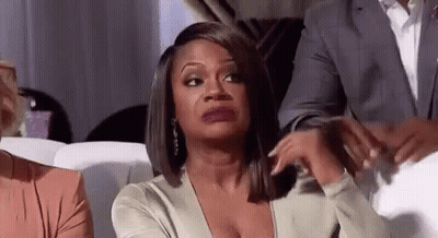 Woman Making Funny Face On Couch GIF