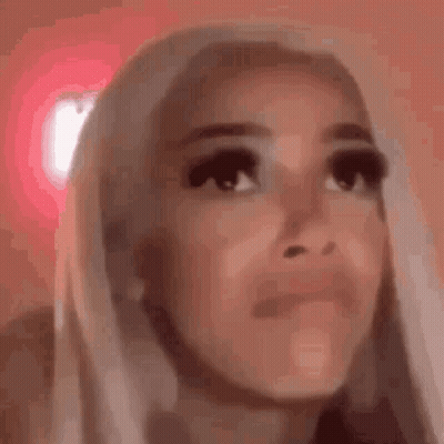 Woman Making Funny Face On Pink Background GIF