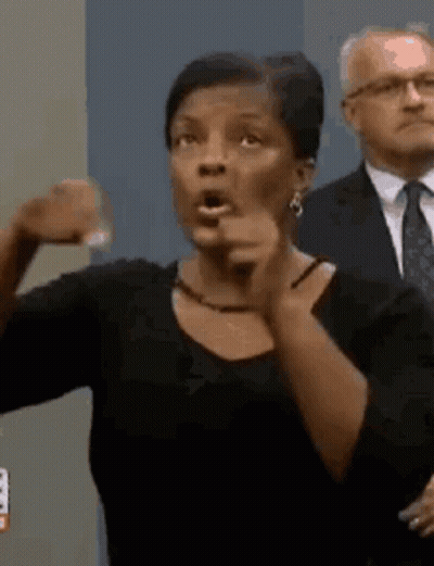 Woman Making Funny Face Pointing At Camera GIF