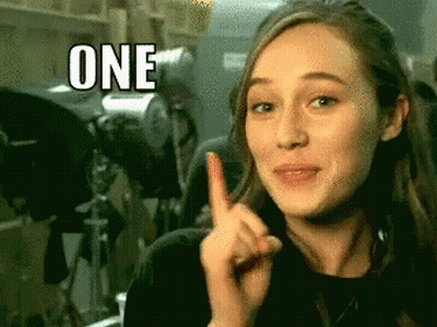 Woman Making Funny Face Pointing Up With One GIF