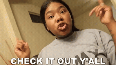 Woman Making Funny Face Saying Check It Out GIF