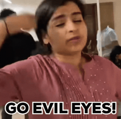 Woman Making Funny Face Saying Go Evil Eyes GIF