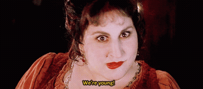 Woman Making Funny Face Saying We're Young GIF