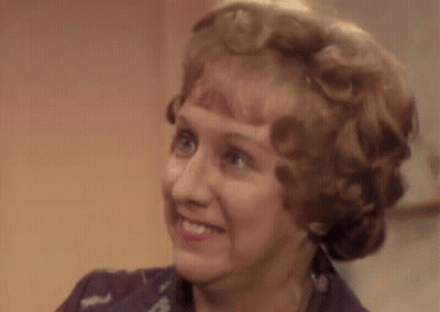Woman Making Funny Face While Smiling GIF