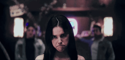 Woman Making Funny Face With A Sign GIF