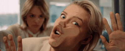 Woman Making Funny Face With Another Behind Her GIF