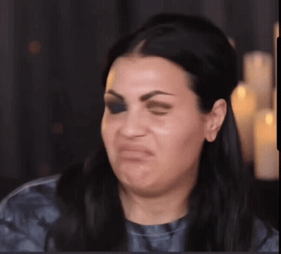 Woman Making Funny Face With Candles GIF