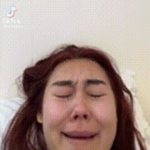 Woman Making Funny Face With Eyes Closed And Mouth Open GIF