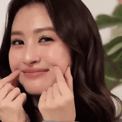Woman Making Funny Face With Fingers GIF