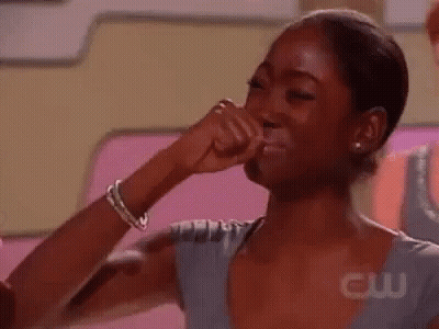 Woman Making Funny Face With Fist In Air GIF