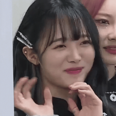 Woman Making Funny Face With Hand GIF