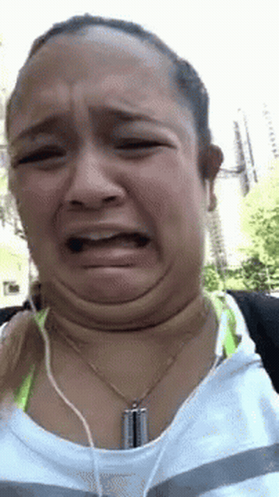 Woman Making Funny Face With Headphones GIF