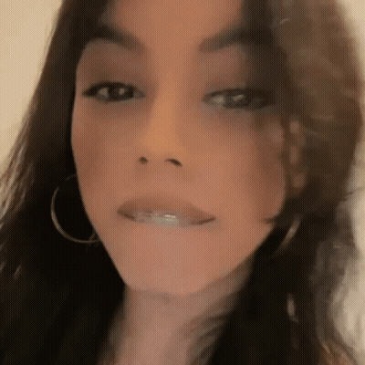 Woman Making Funny Face With Hoop Earrings GIF