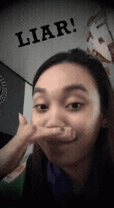 Woman Making Funny Face With Liar Above GIF
