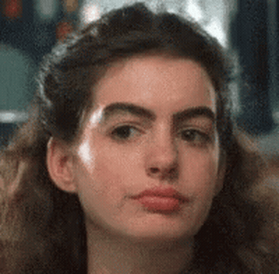 Woman Making Funny Face With Long Hair GIF