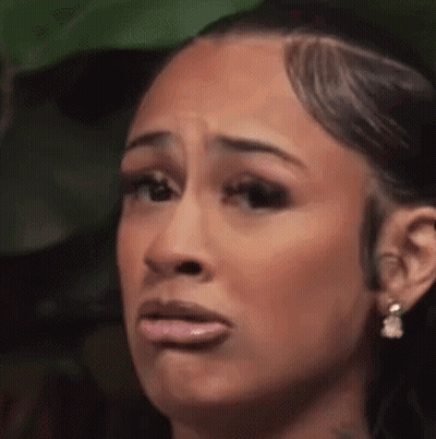 Woman Making Funny Face With Mouth Open And Earrings GIF