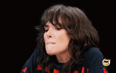 Woman Making Funny Face With Shark On Sleeve GIF