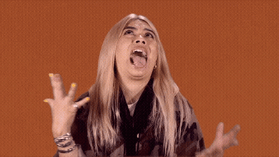Woman Making Funny Face With Tongue Out GIF